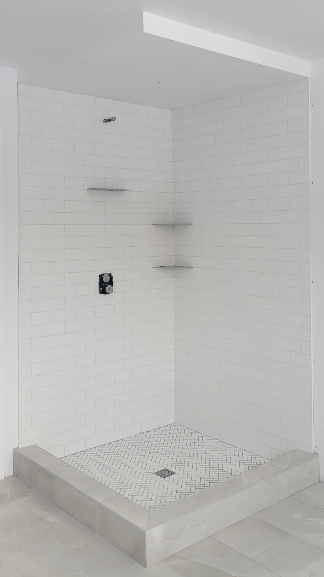 White Subway Tile – Herringbone Floor