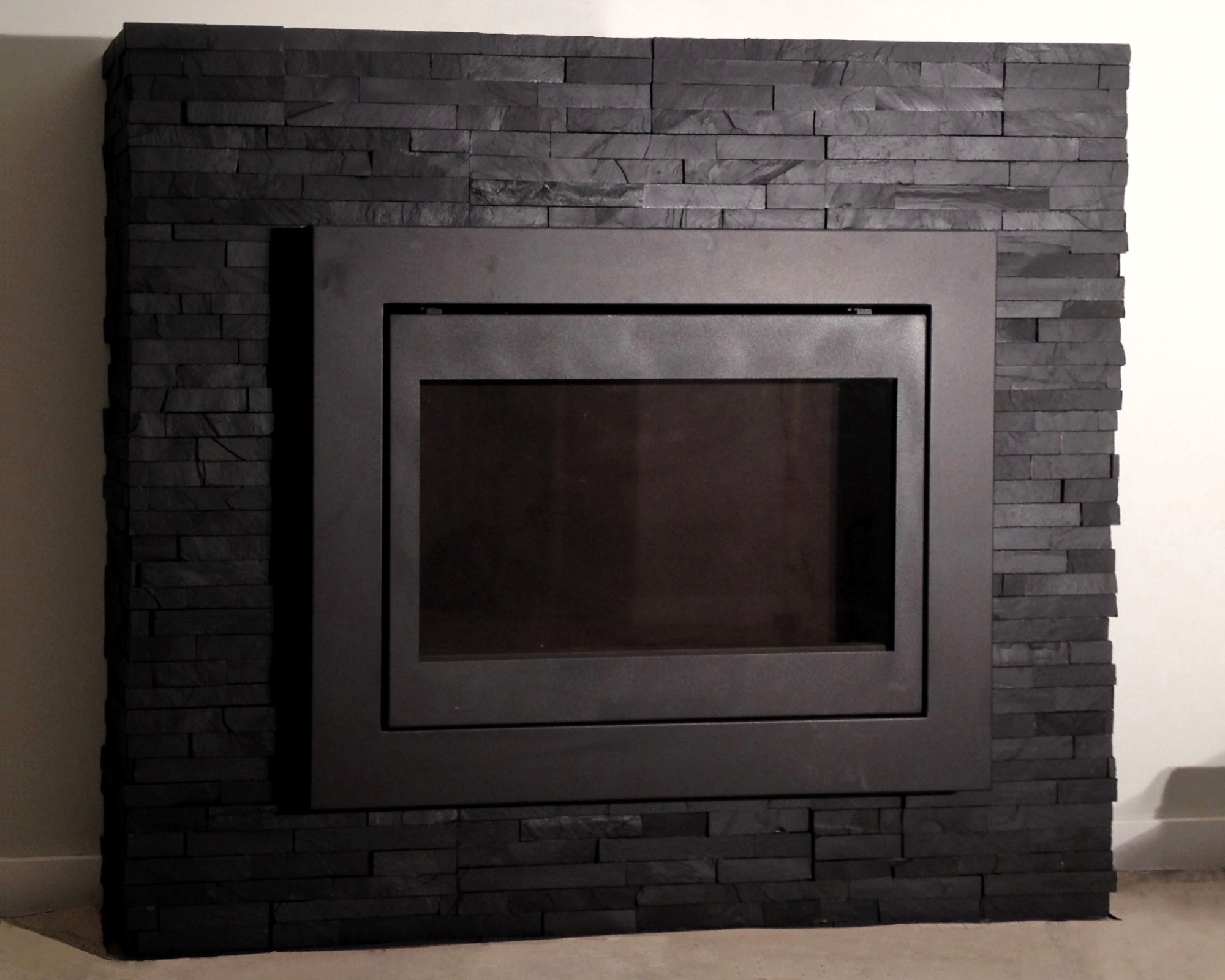 Black Stacked Stone Fireplace