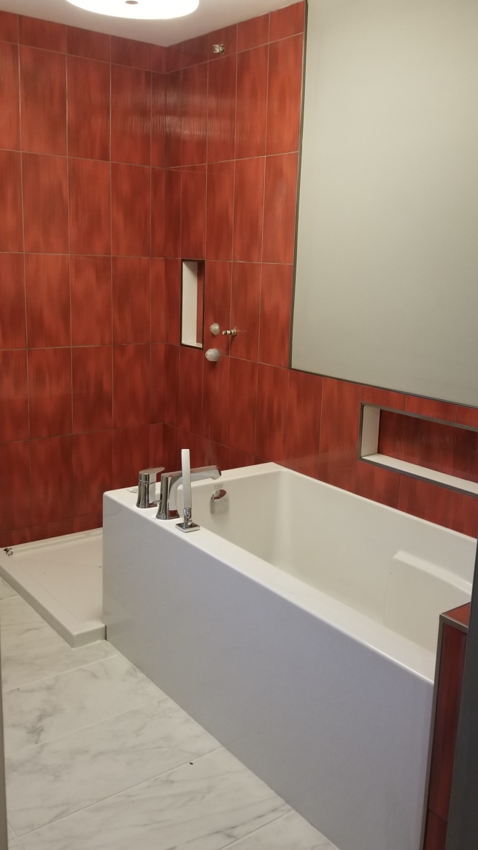 Red tile bathroom with soaker tub